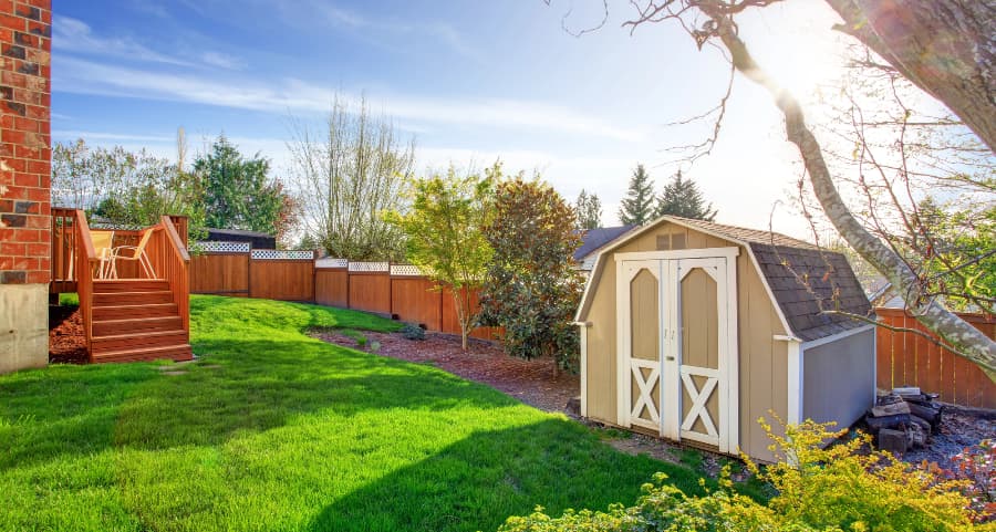 Fenced backyard with storage shed in Jonesboro